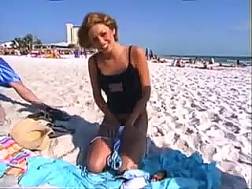 undresses beach