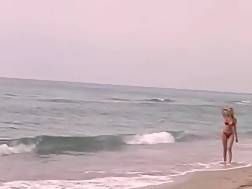 blonde girlie riding beach