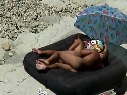 couple sunbathing beach