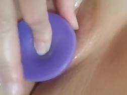 closeup bald vagina dildo