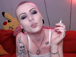 shaved camgirl smokes cumming