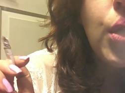 blackhaired teenager smoking white