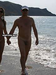 couple walking nude beach